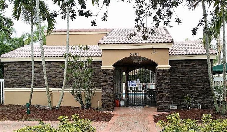 A house with a brick walkway leading to it