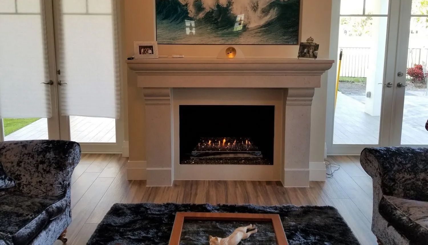 There is a fireplace in the middle of the living room.