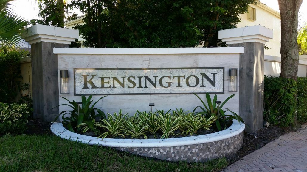 A sign that says kensington in front of a house