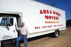 Area Wide Movers truck with owner