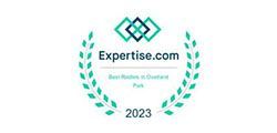 Expertise.com award badge for Best Roofers in Overland Park, 2023. Green wreath design.
