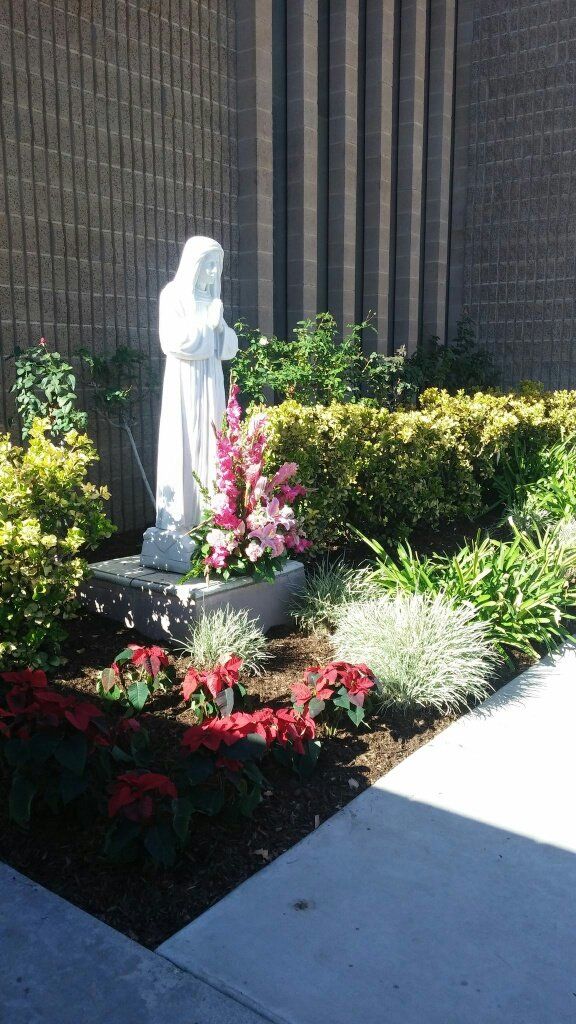 Colorful flowers and stone sculpture