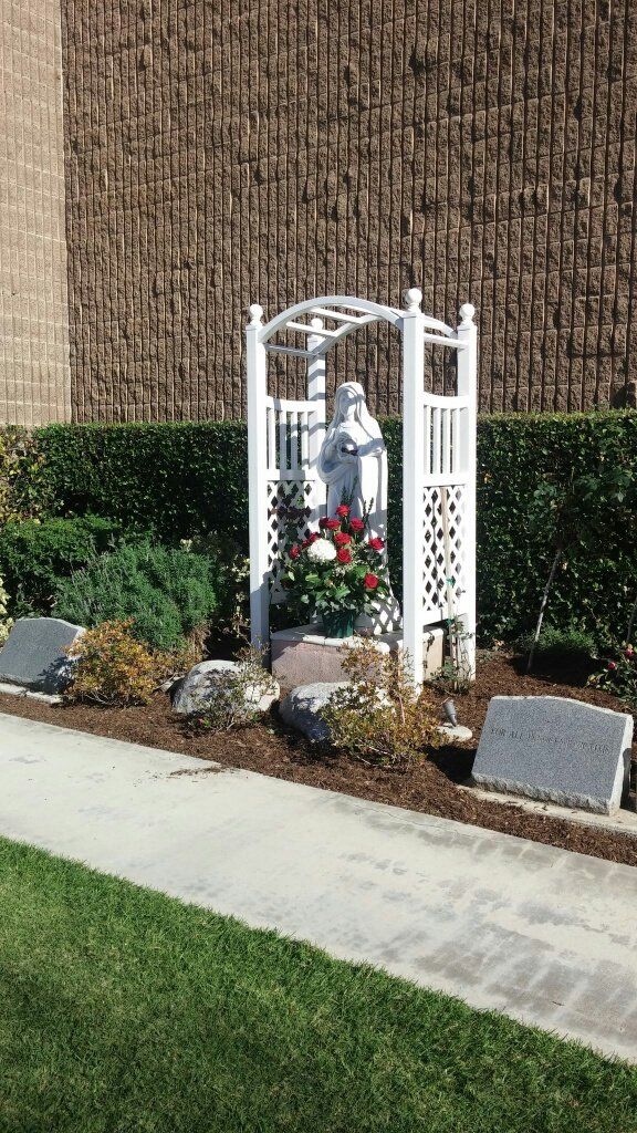 Memorial stones and red roses