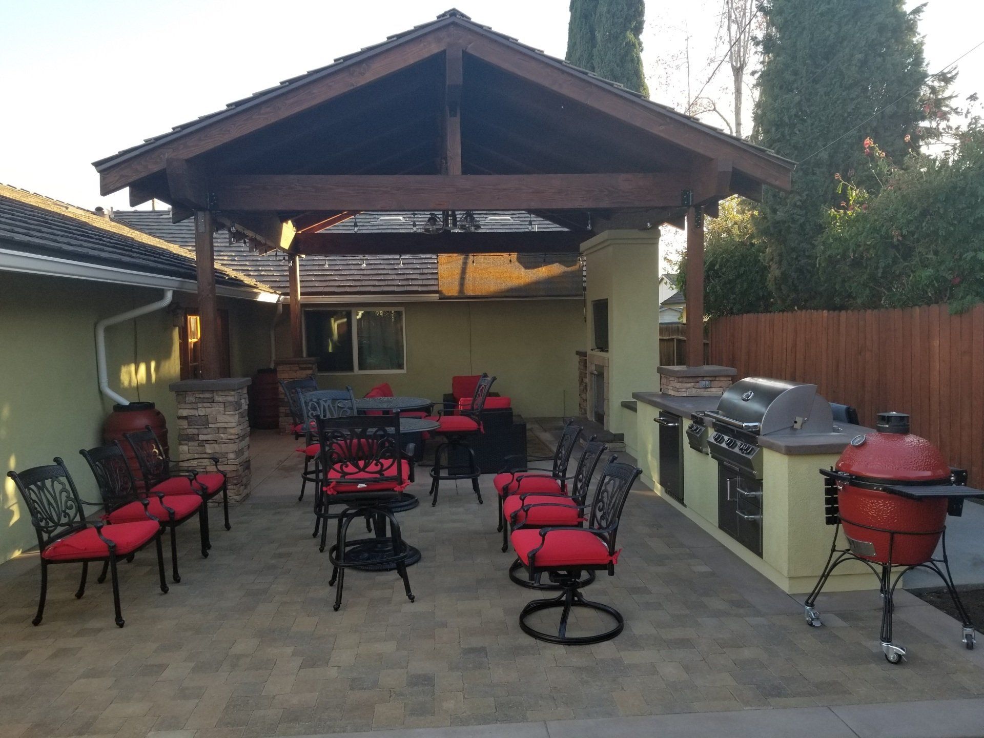 Outdoor kitchen with red chairs