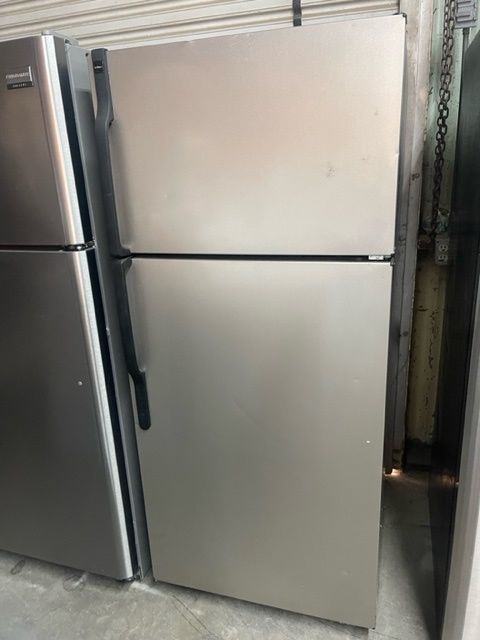Two door silver refrigerator with gray handles