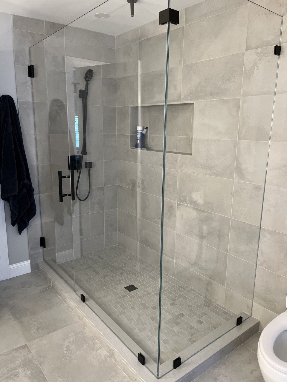 tile bathroom with glass stall