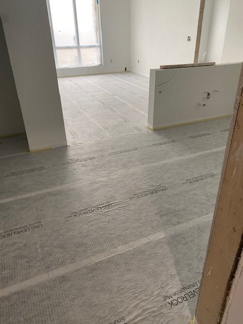 a room with a white floor and white walls is being remodeled