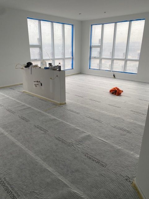 a large room with a lot of windows and a white floor