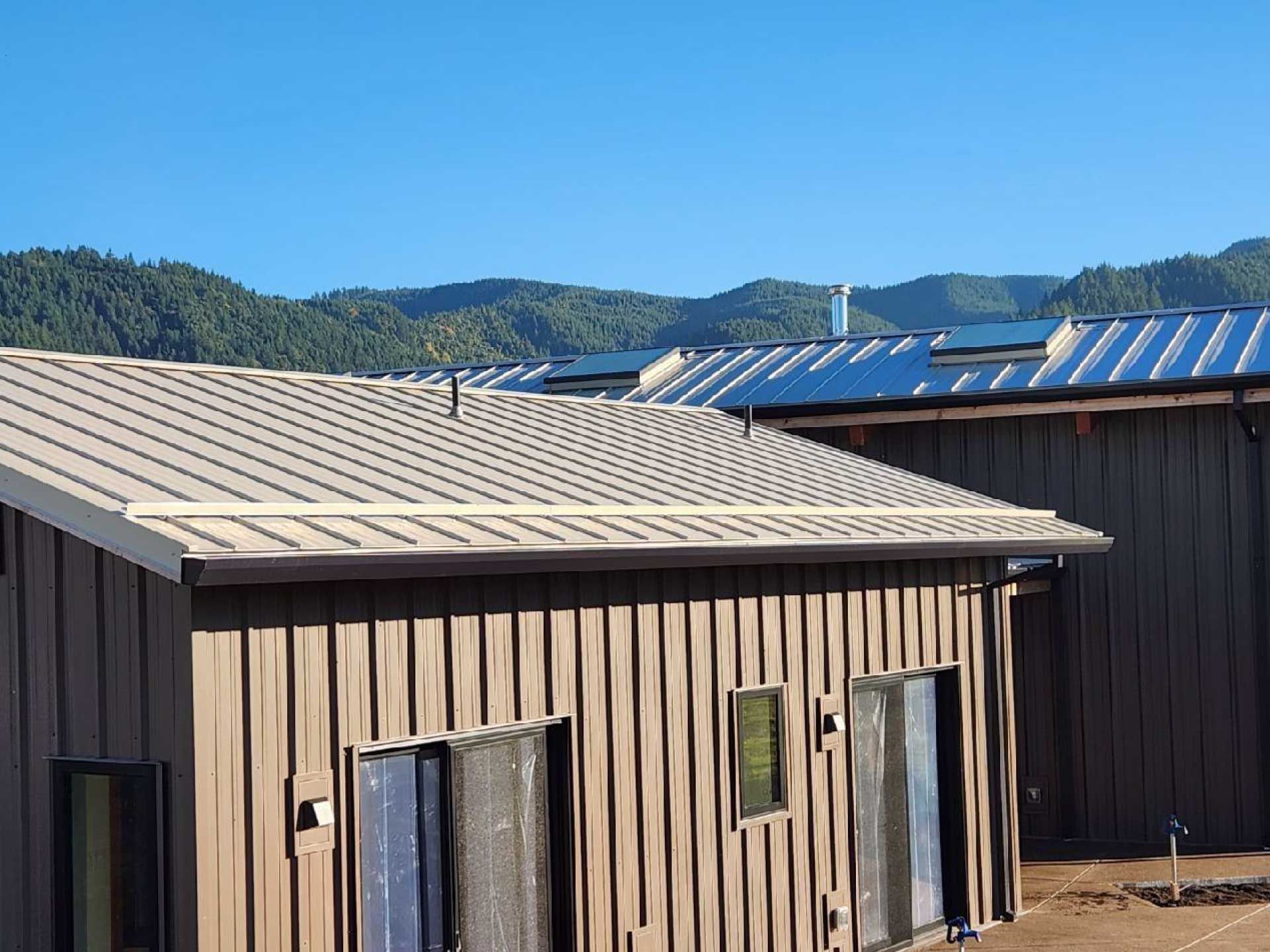 metal-roofed buildings with vertical siding