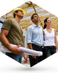 A couple and an engineer looking at the roof framework