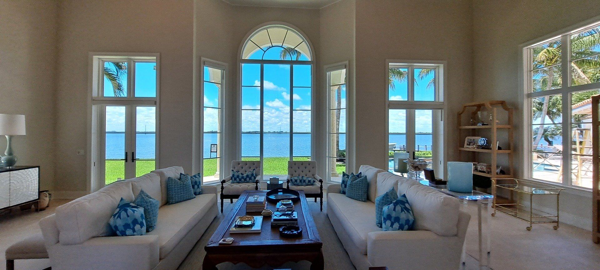 gorgeous living area with a beach view