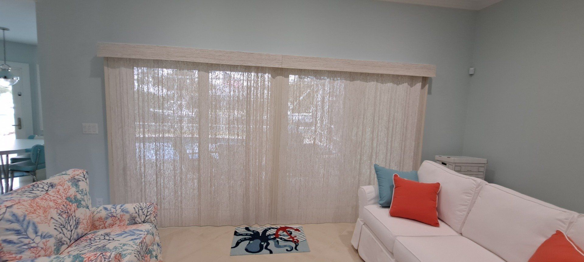 elegant living area with a custom window décor