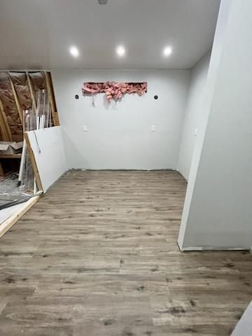 a room with a vinyl floor and white walls is being remodeled