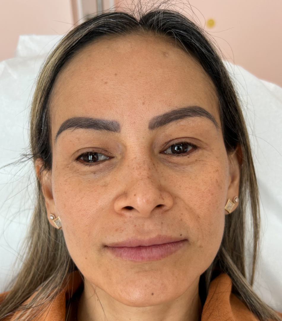 a close-up of a woman's face with a smile on her face
