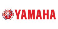 The red Yamaha logo, featuring the wordmark alongside a circular emblem containing three interlocking tuning forks.