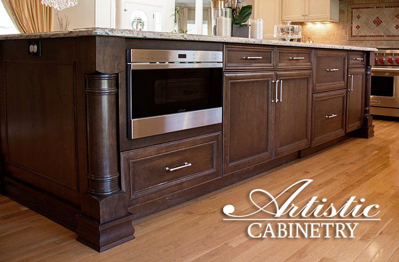 A kitchen with artistic cabinetry written on the bottom