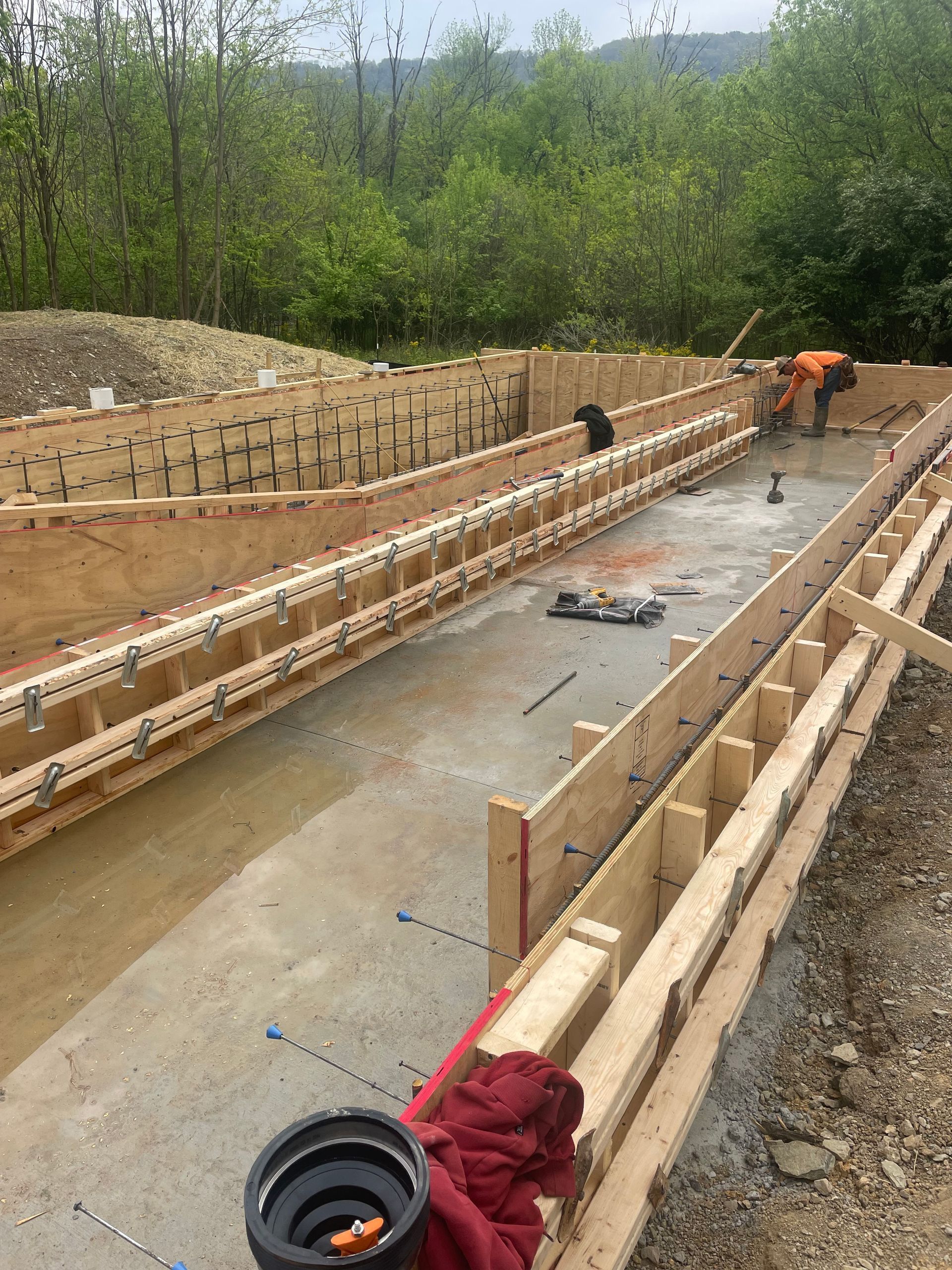 A group of construction workers are working on a large wooden structure.