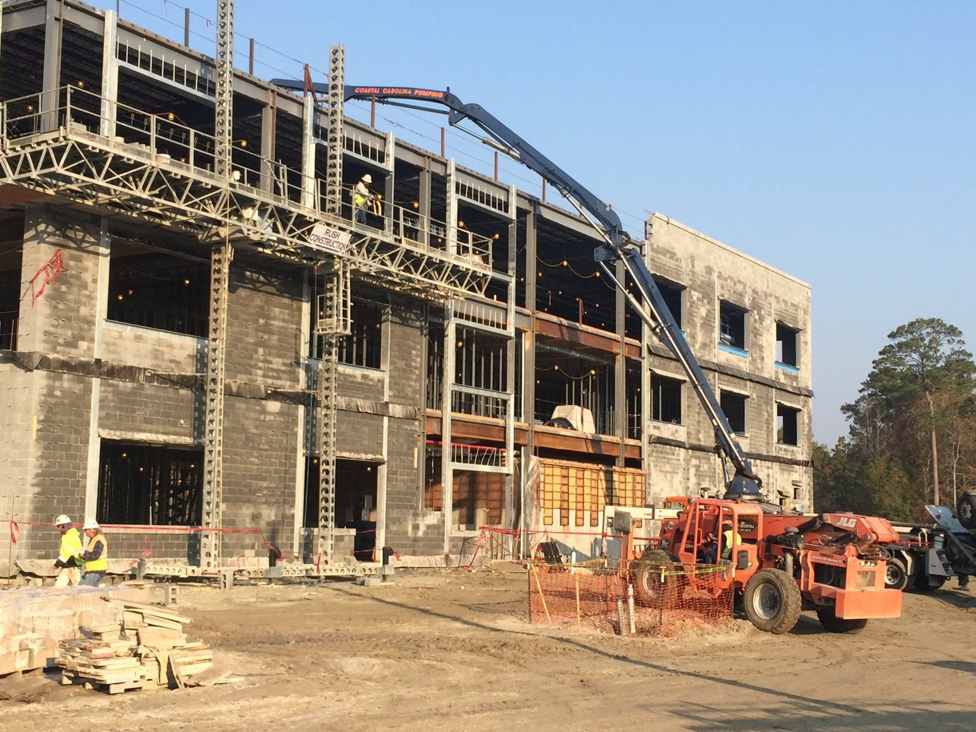 A construction site with a large building under construction.
