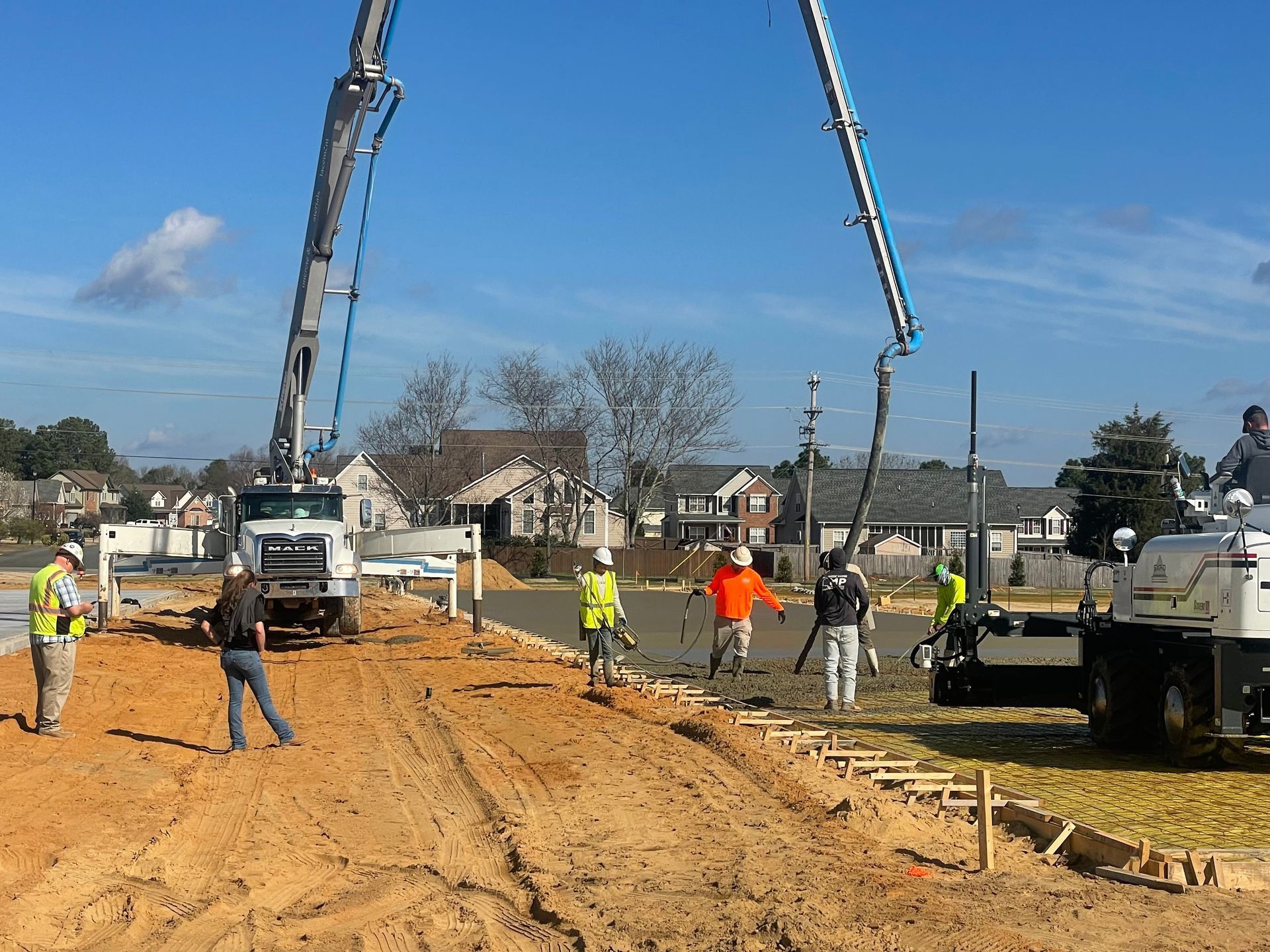 A group of construction workers are working on a construction site.