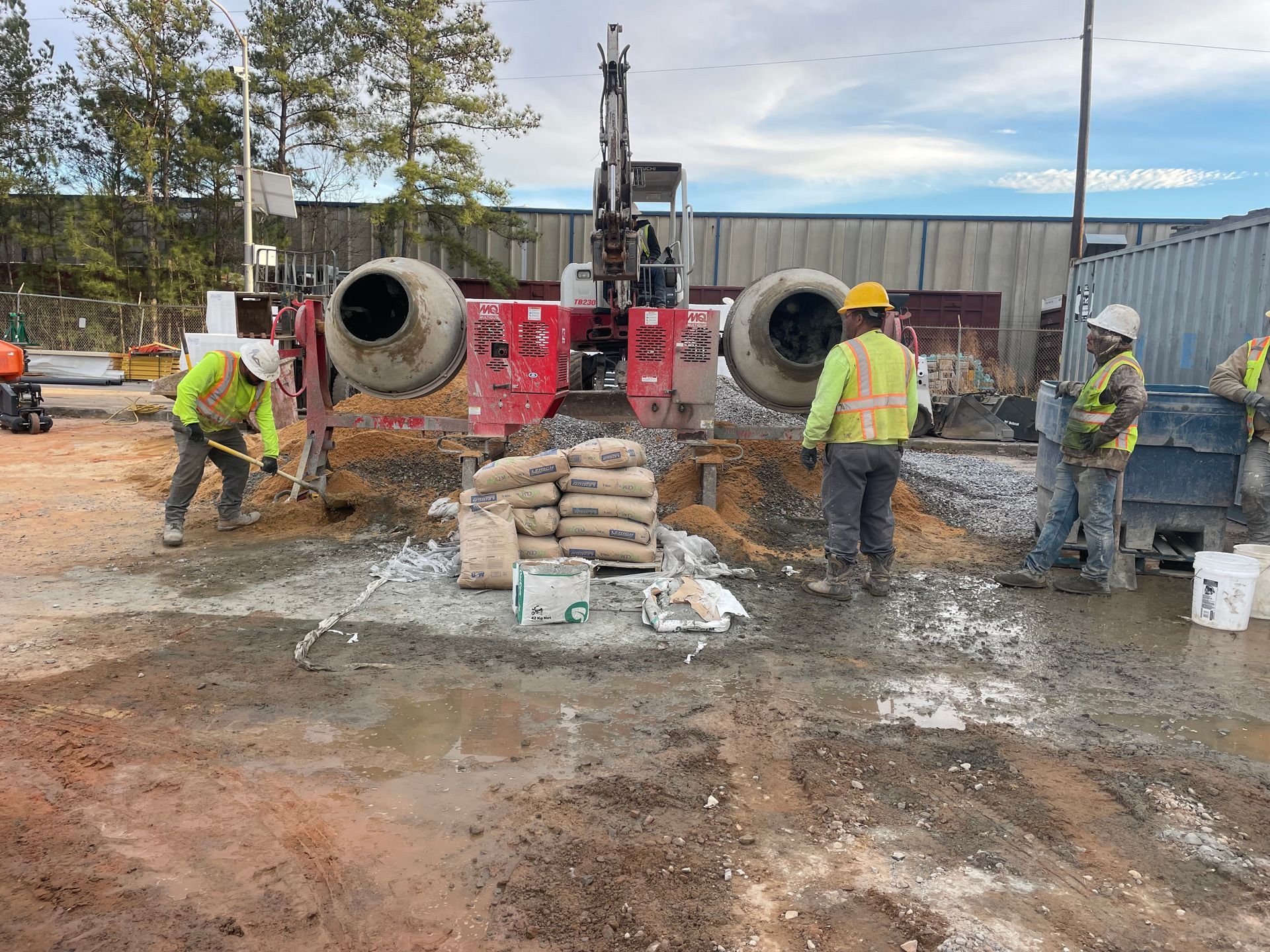 A group of construction workers are working on a construction site.