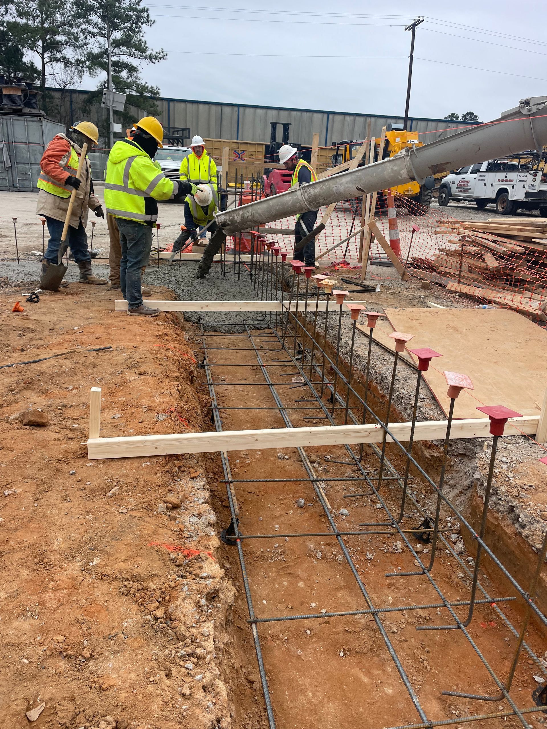 A group of construction workers are working on a construction site.