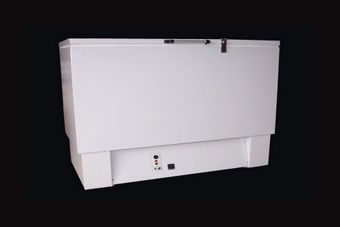 A white chest freezer with a black background