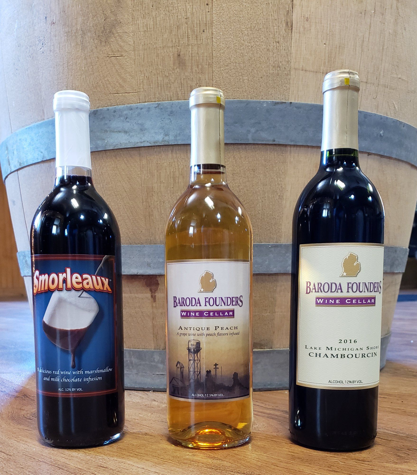 Three bottles of wine one of which says imorleaux