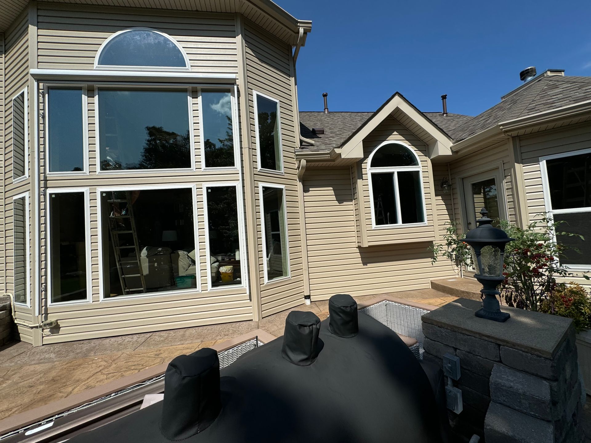 A large house with a lot of windows and a roof