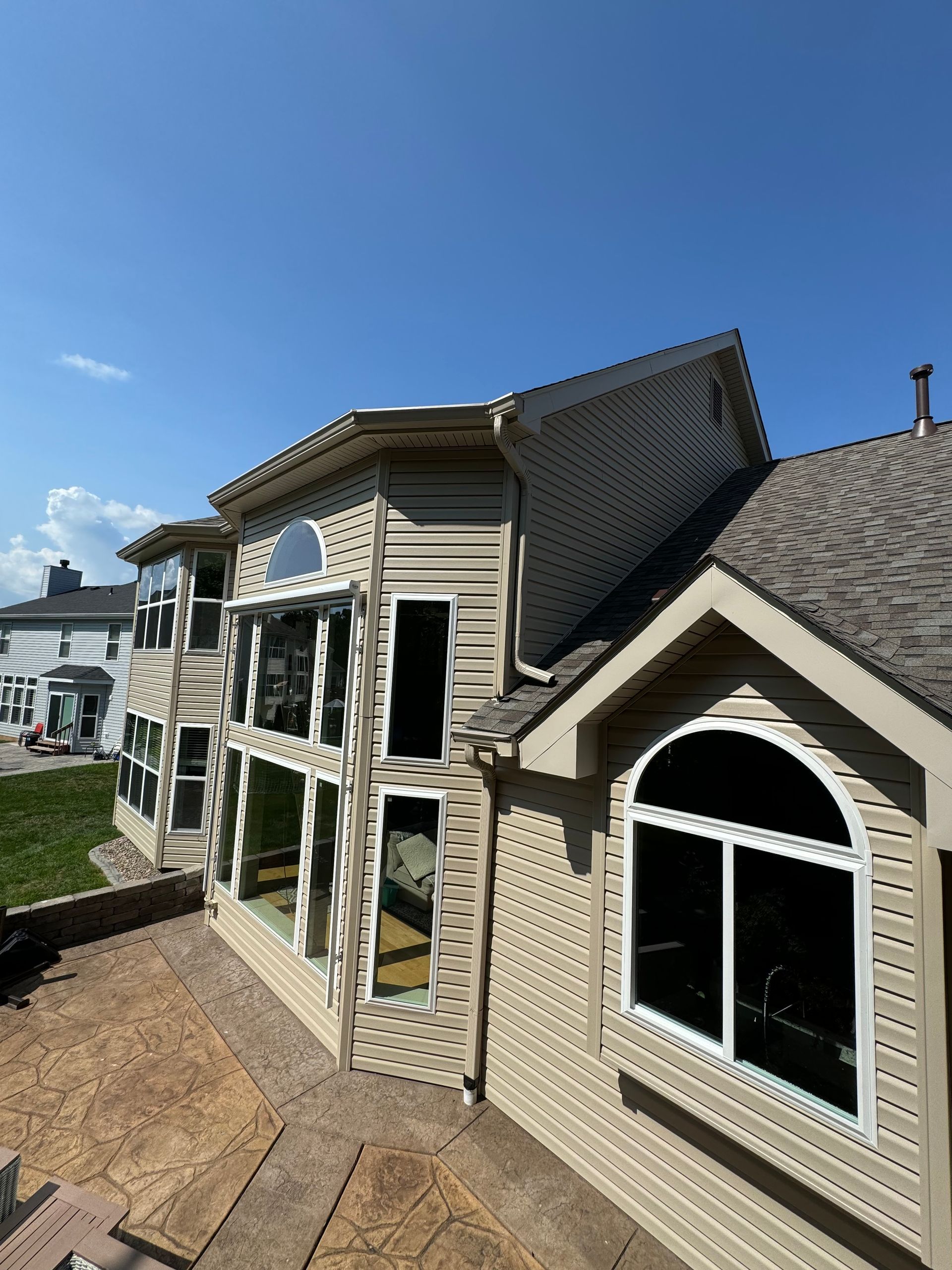 A large house with a lot of windows on a sunny day