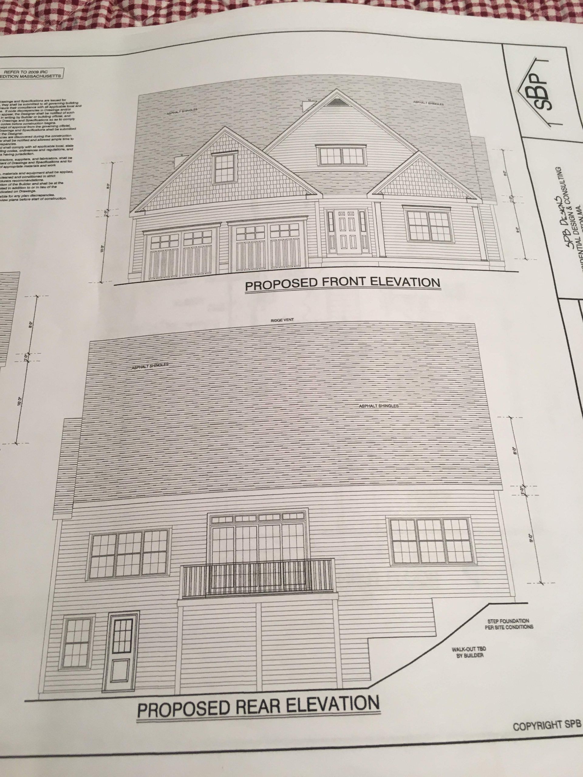 Architectural drawings of a building with a domed roof and surrounding structures; two views are presented.
