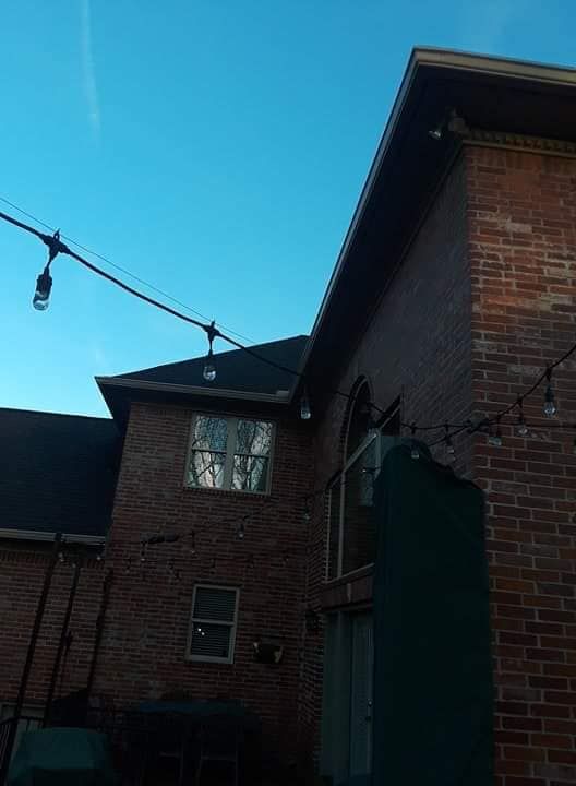A brick building with a blue sky in the background