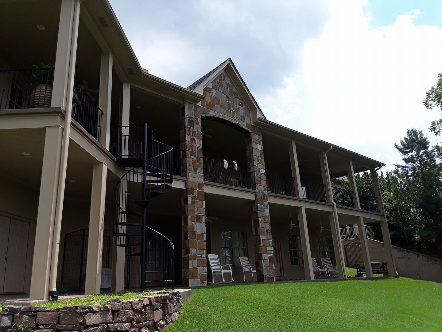 A large house with a spiral staircase on the side of it