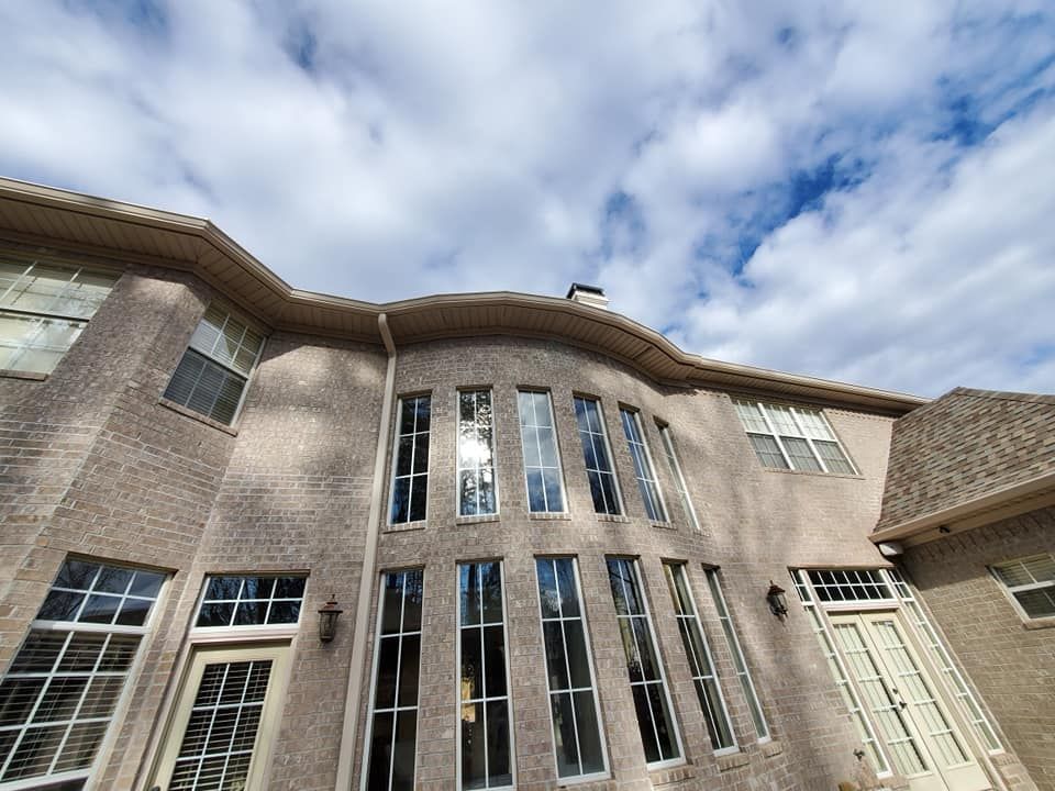A large brick house with a lot of windows