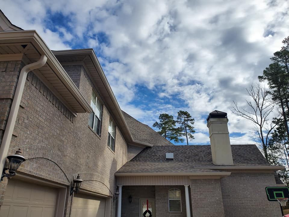 A house with a chimney on the side of it