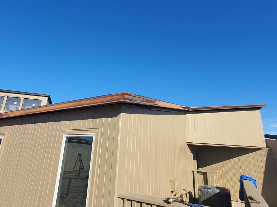A house with a blue sky in the background