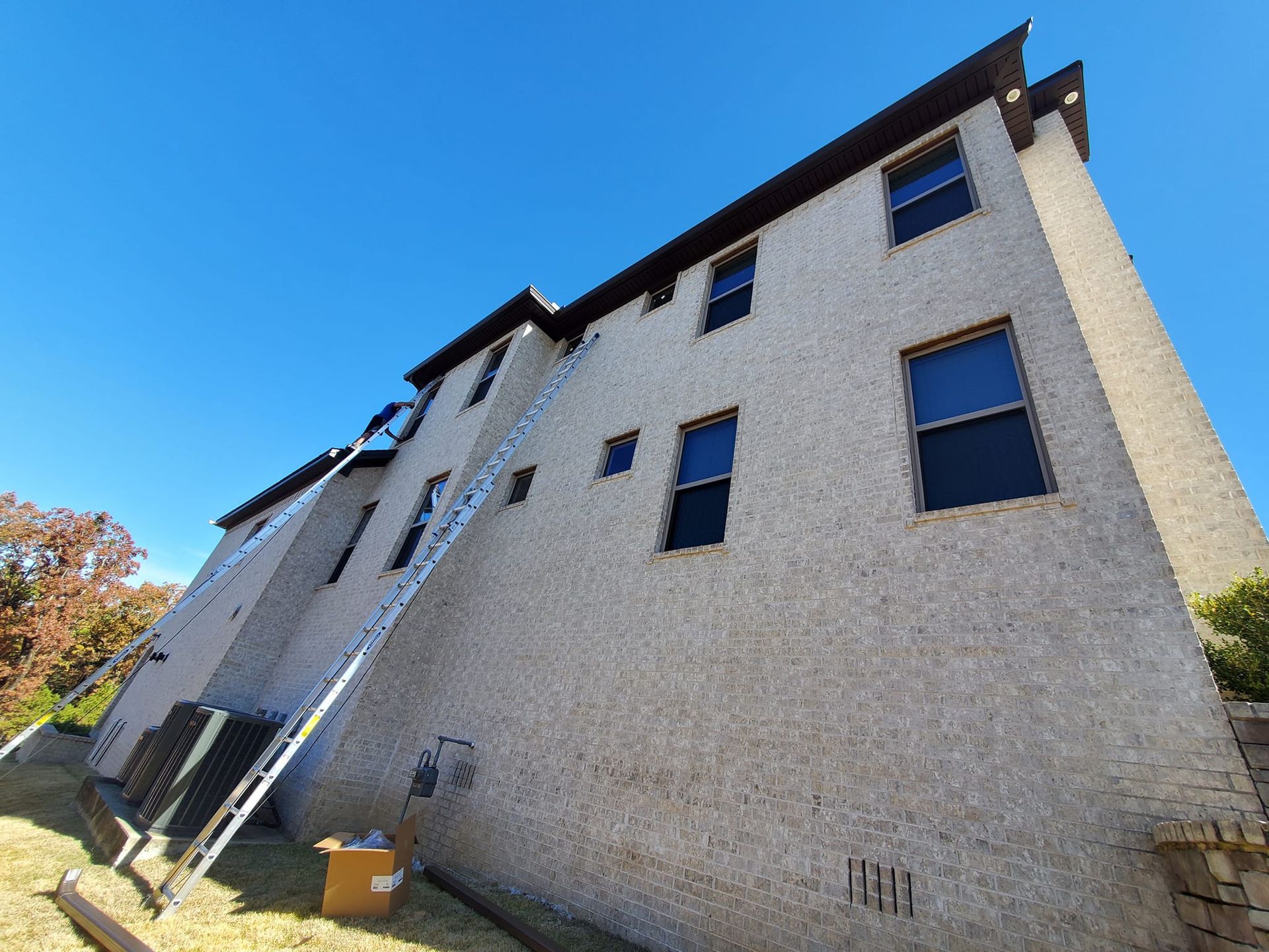 A large building with a ladder attached to the side of it.