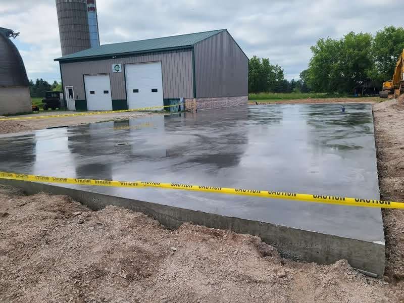 A large concrete slab is sitting in front of a building.