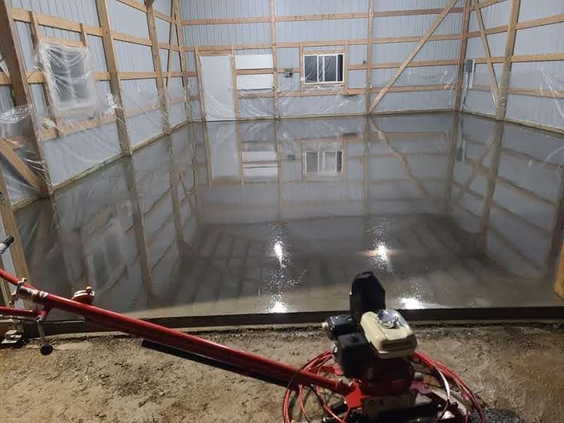 A machine is sitting in the middle of a garage.