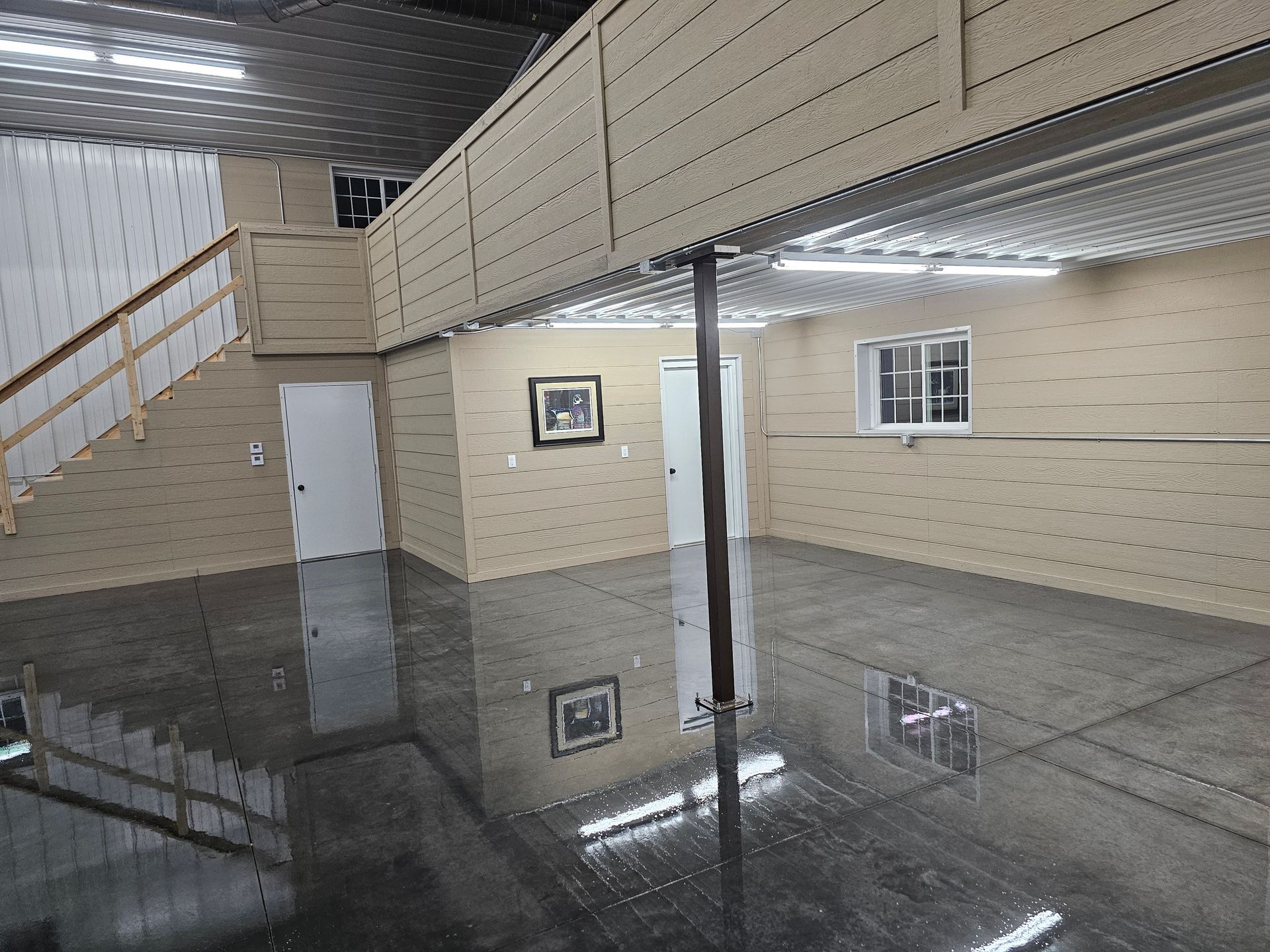 A flooded basement with a balcony and stairs
