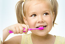 Girl brushing her teeth