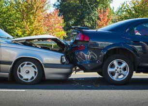 Auto accident involving two cars on a city street