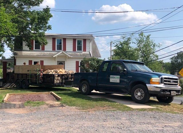 Green Tree Property Care & Maintenance's truck delivering firewood