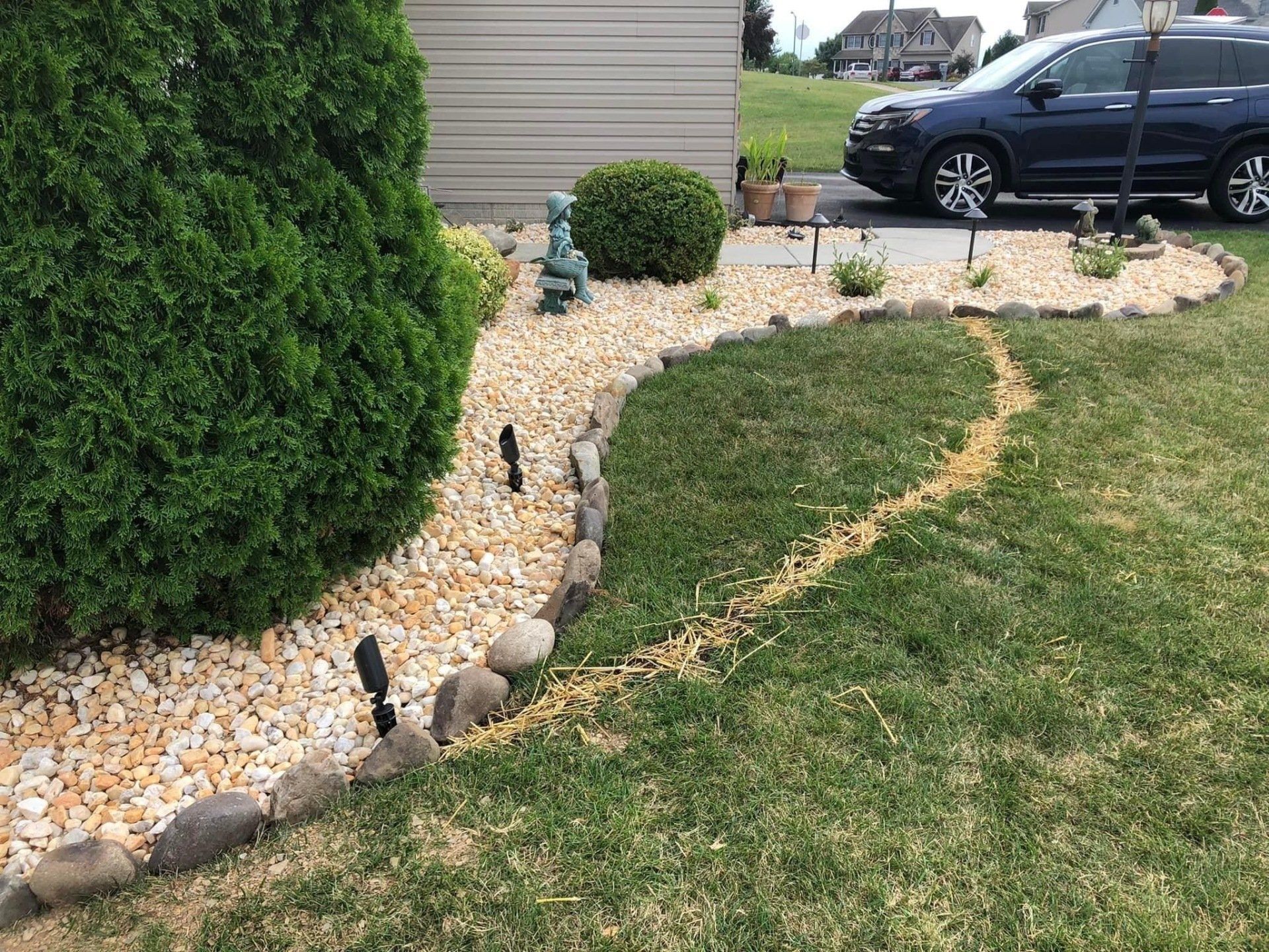 Newly installed walkway with pebbles and rocks
