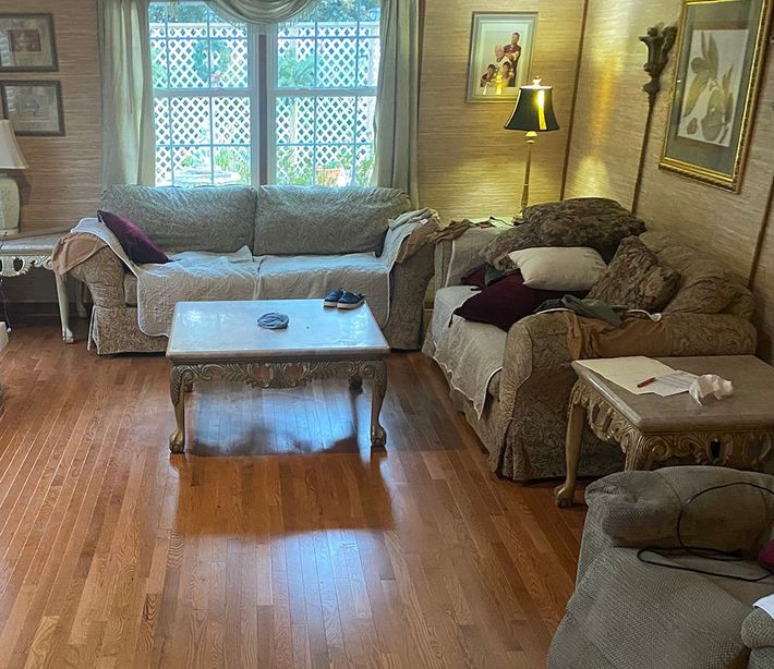 A living room filled with furniture and a coffee table