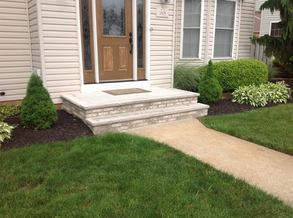 A house with a walkway leading to the front door