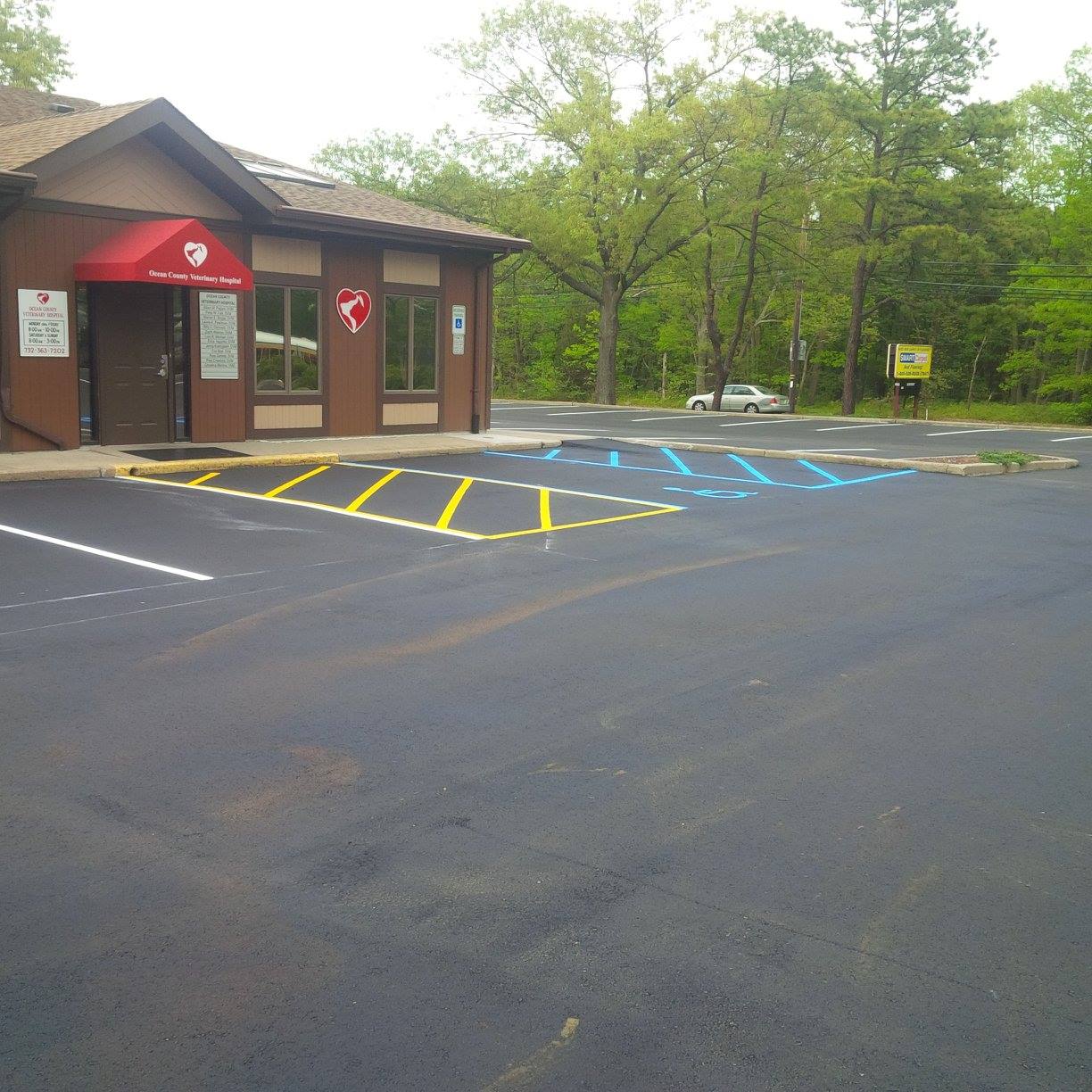 A building with a red awning and a stop sign