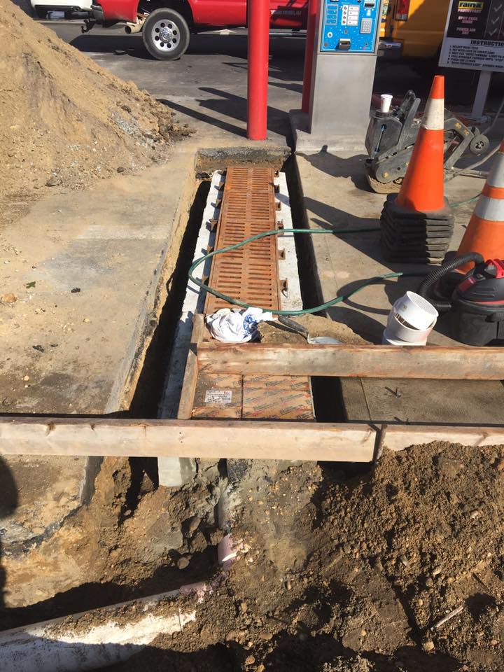 A construction site with a red truck parked in the background