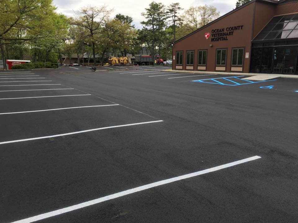 A parking lot in front of a building that says county community center