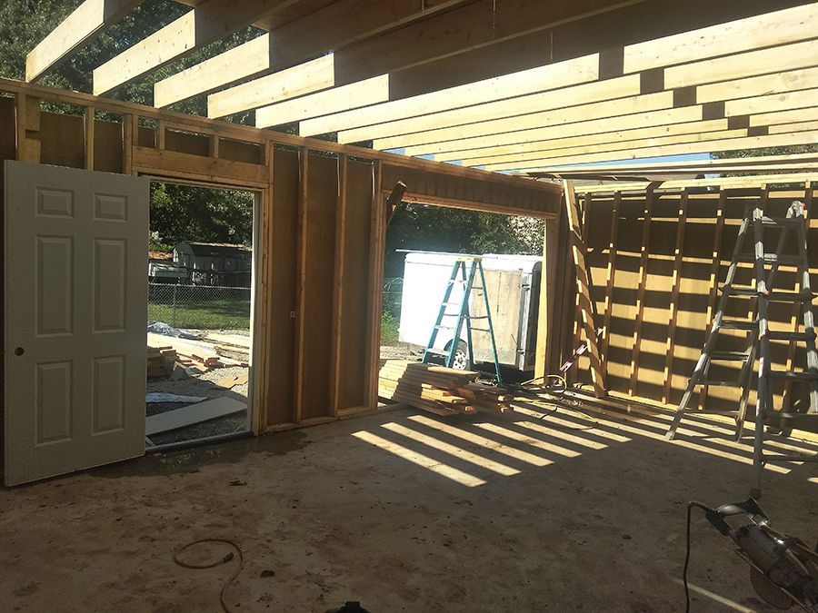 A room with a door and a ladder in it is being built.