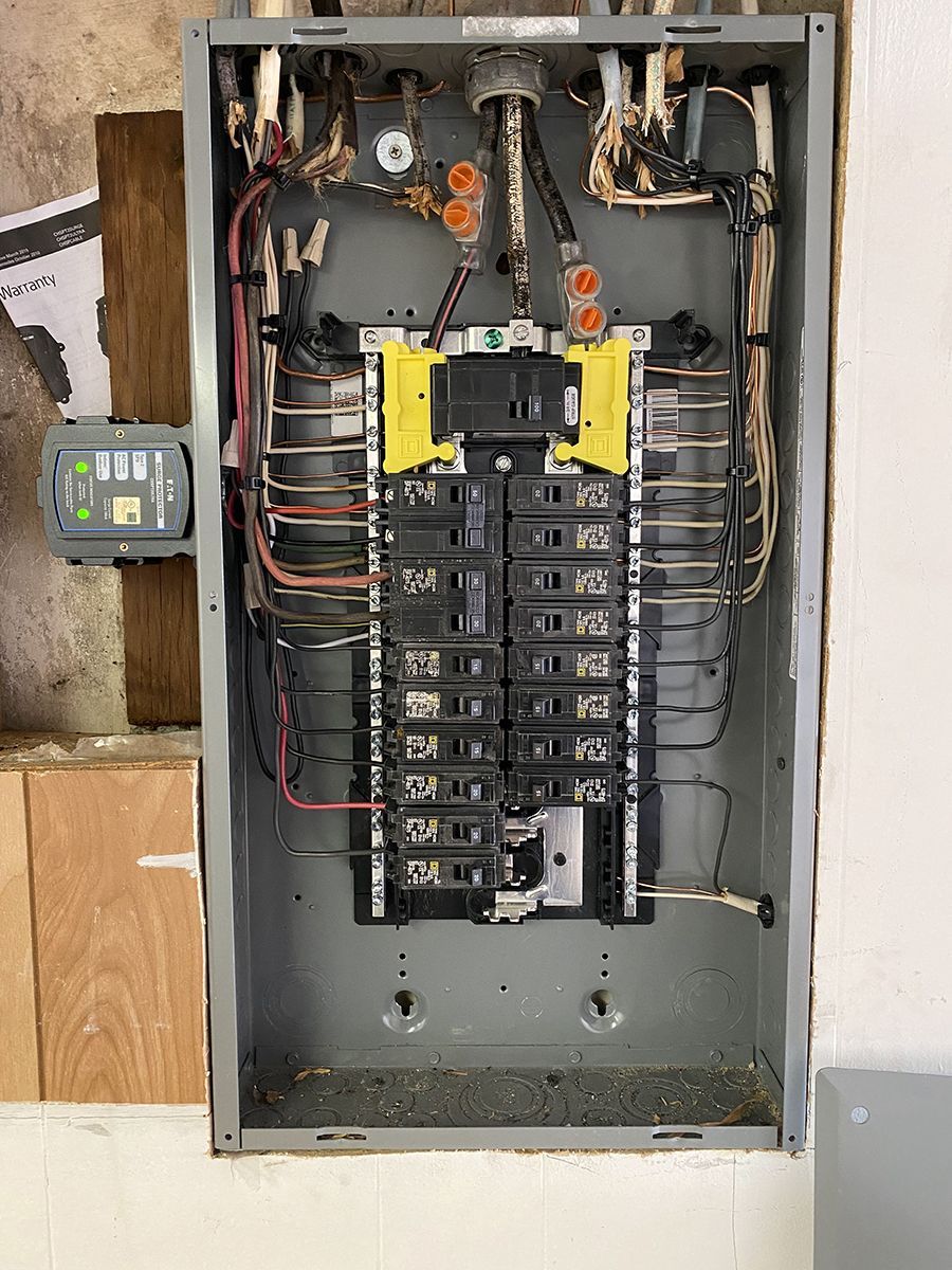 A close up of a electrical panel on a wall.